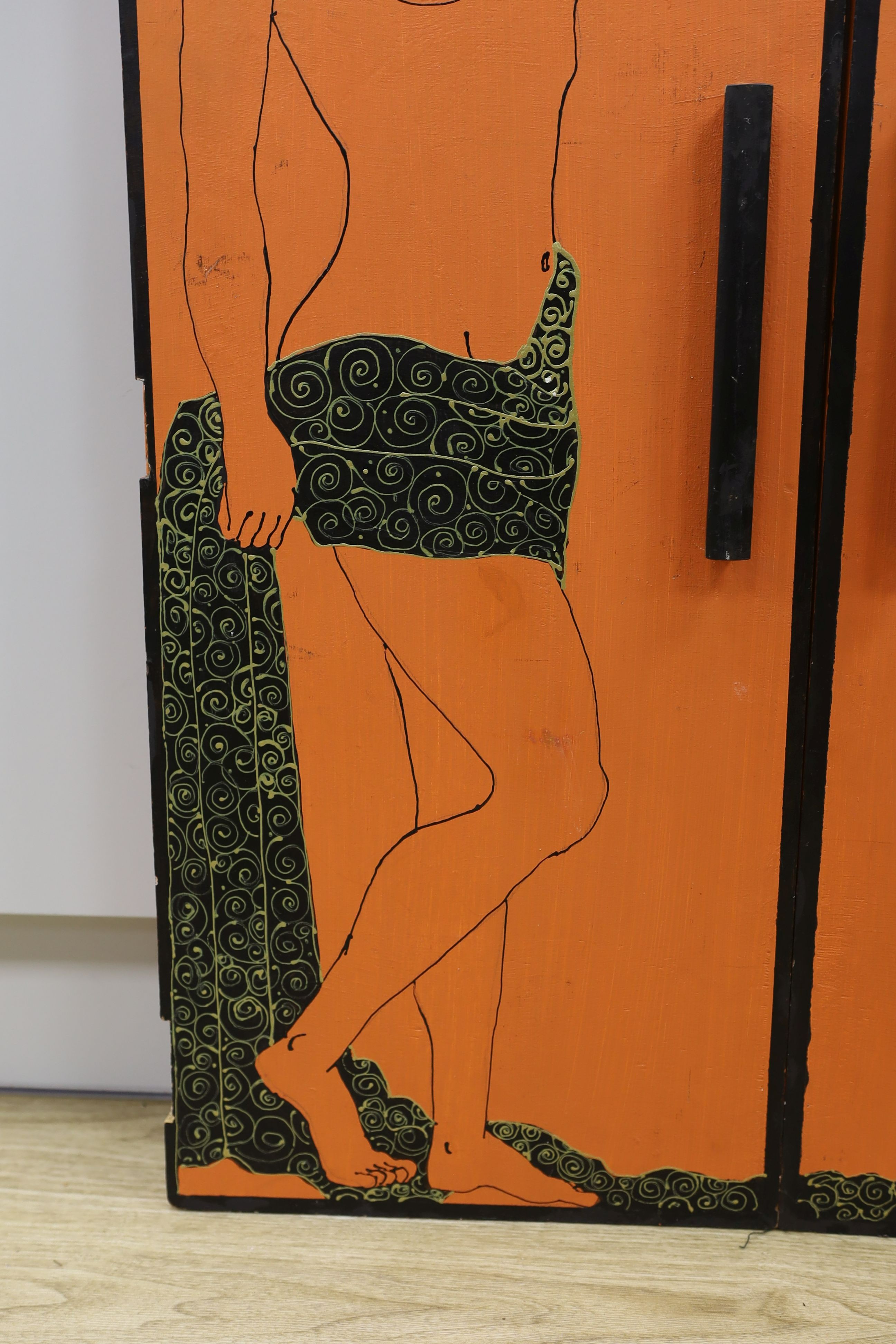 A pair of orange painted figural 1960's cabinet doors, by repute from 'Biba', 36cms wide x94 cms high.